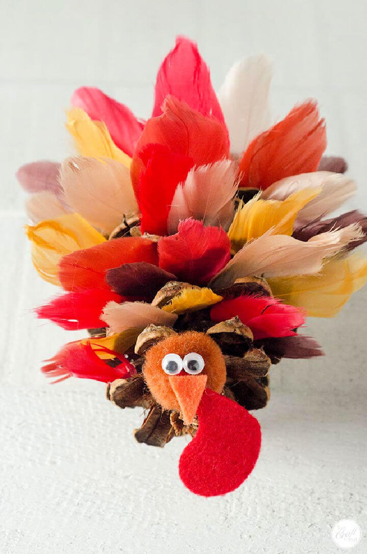 15 Creative Feather Crafts To Make DIY To Make   Pinecone Turkeys With Silk Feathers 